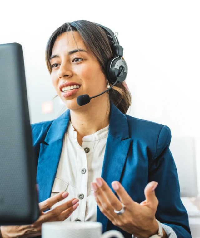 Professional interpreter wearing a headset at a computer