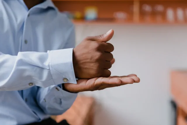 Hands forming signs during a conversation