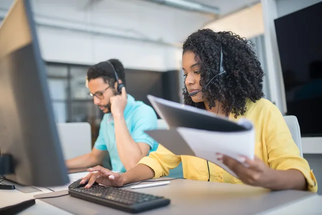Crest interpreting services: headset users working with documents and computers