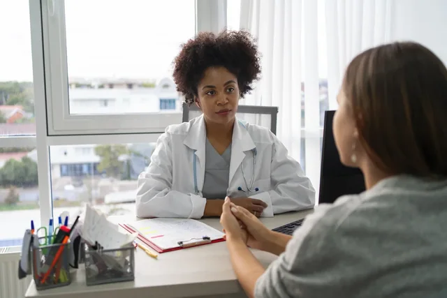 Crest translation services: a healthcare professional discussing information with a patient