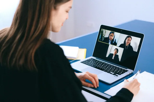 Crest interpreting services: a person joining a video meeting on a laptop