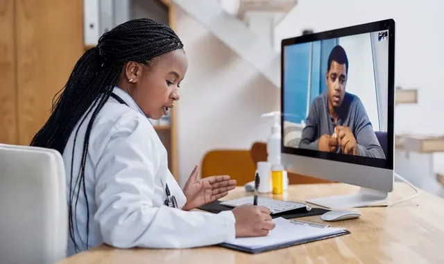 Crest interpreting services: a healthcare professional speaking with someone on a video screen