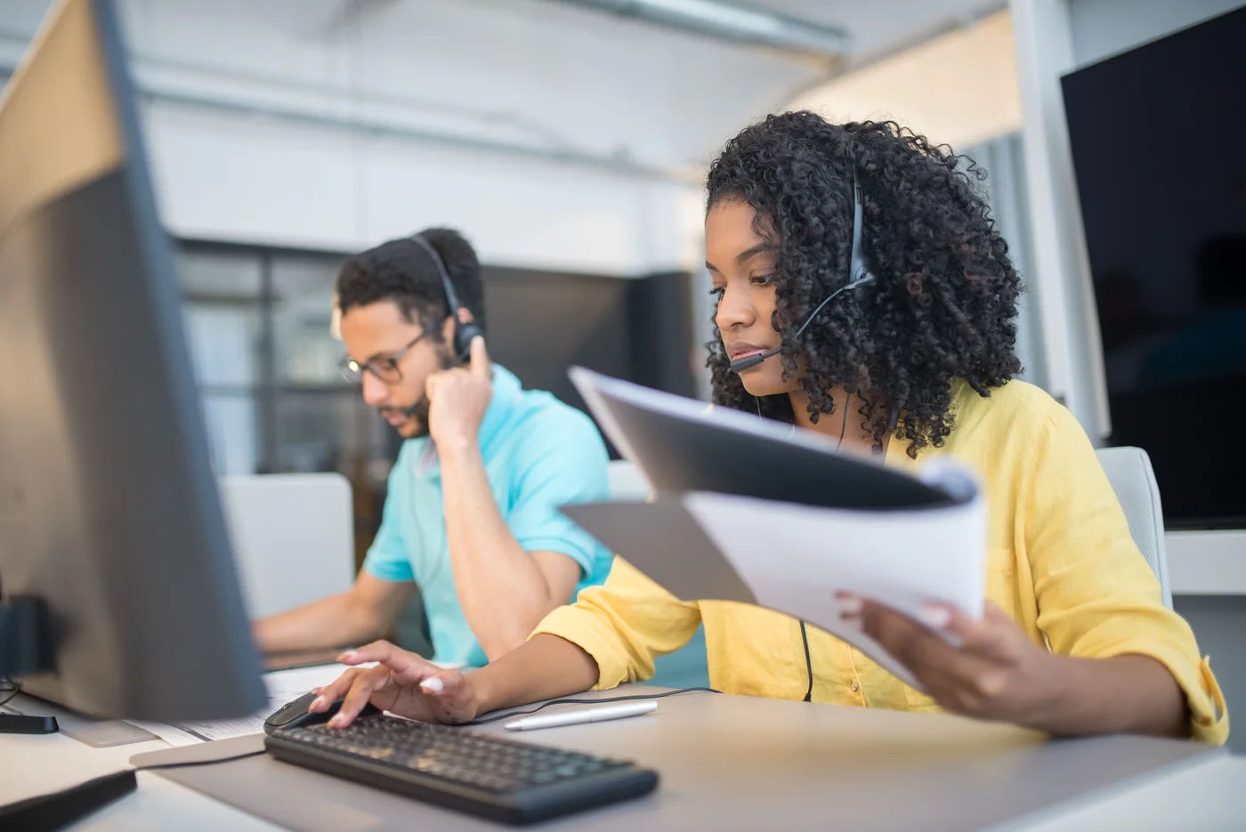 Headset users working with documents and computers